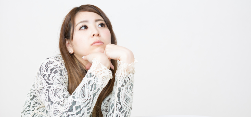 悩んでる人の画像